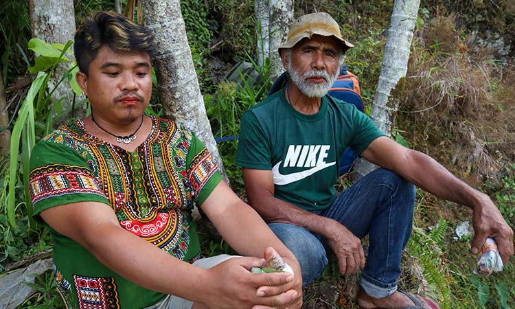 2 mens near Banaue Rice terraces Philippines